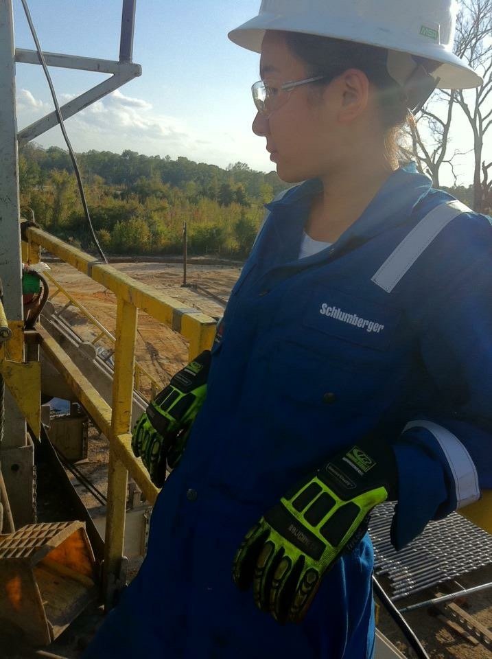 Nicole Wu working as a field engineer in protective equipment at an oil and gas drilling site.